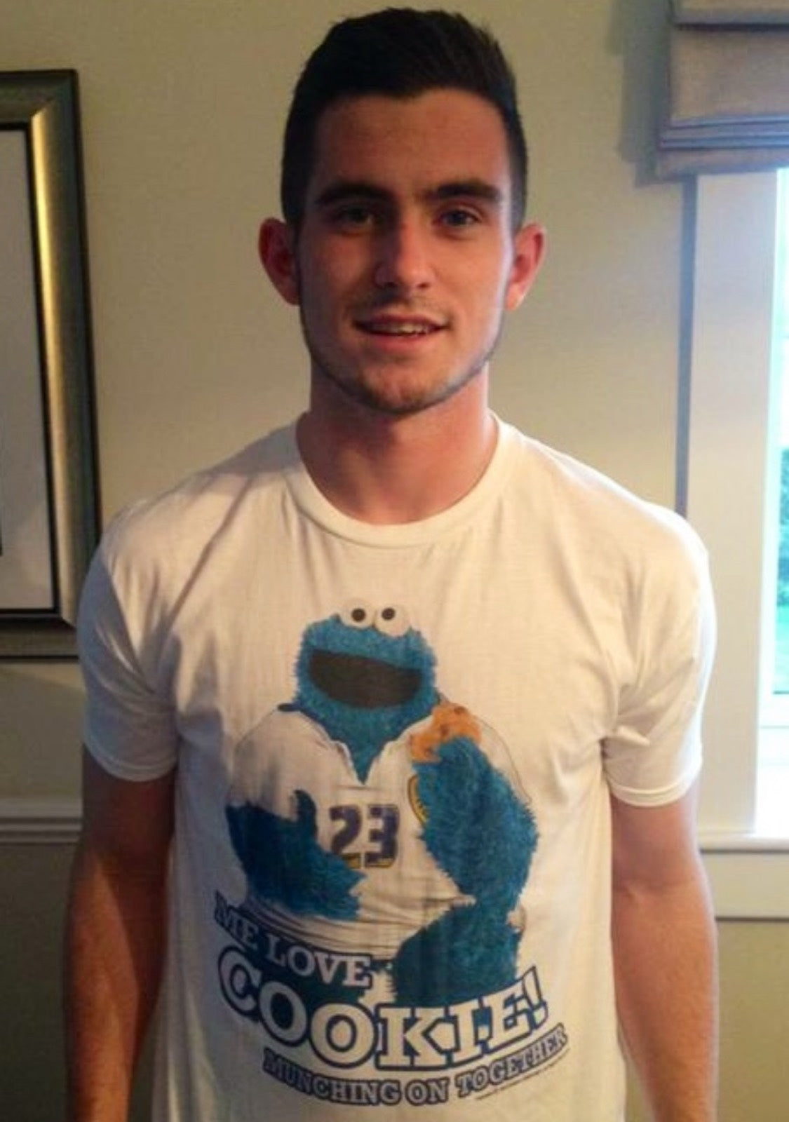 Lewis Cook wearing the We Love Cookie Forever Leeds tee