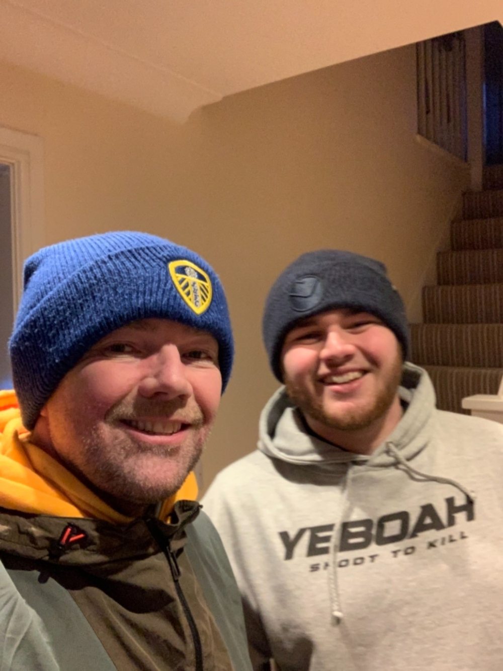 Two Leeds fans, one in the Yeboah hoodie